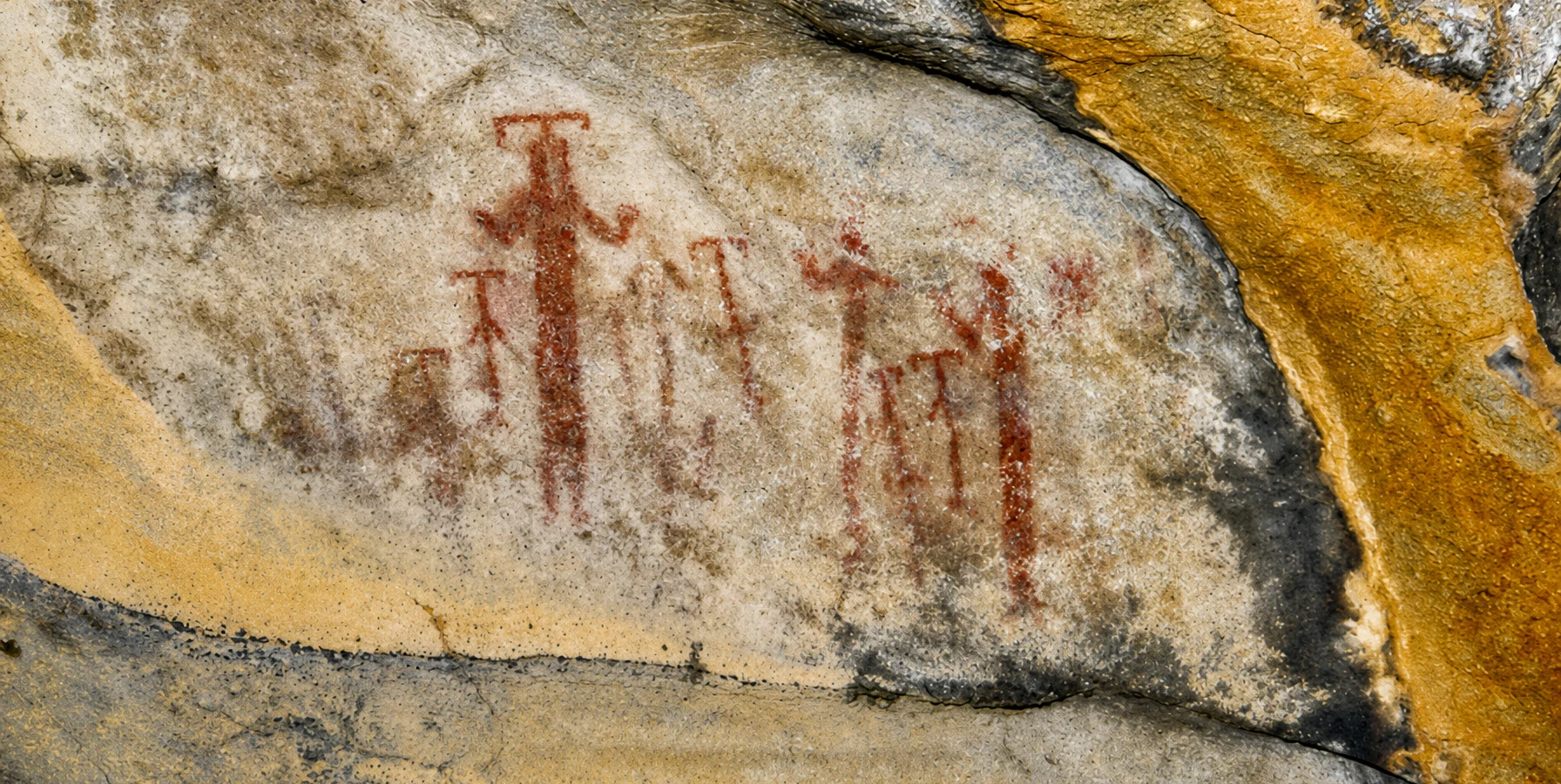 Prehistoric red human figure paintings on natural rock surfaces in the Latmos Beşparmak Mountains