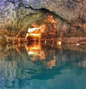 Boat journey across the underground lake inside Altinbesik Cave