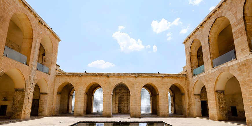 Stone courtyard and arches of Kasimiye Madrasa in Mardin