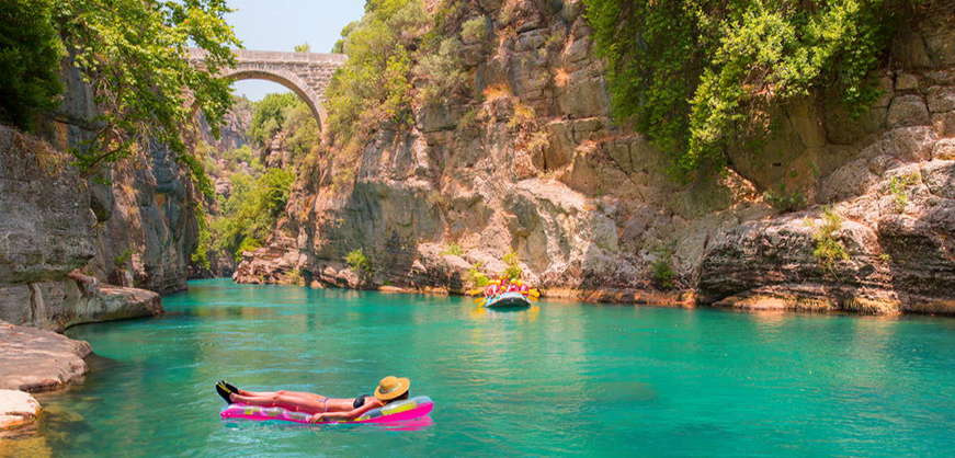 Turquoise river and historic bridge in Koprulu Canyon National Park